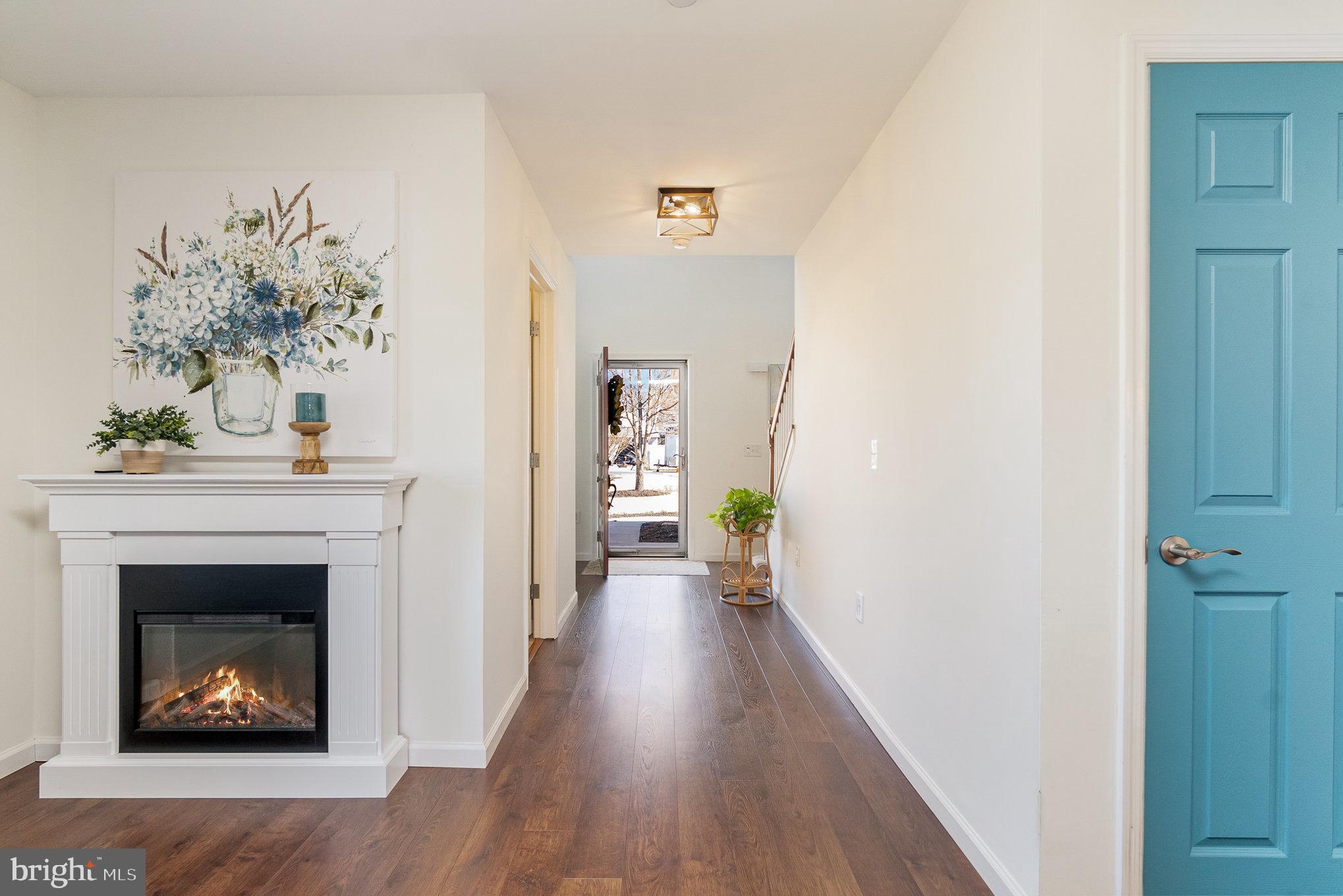 332 Miles Essex, MD 21221 - Photo 18 of 45 a view of a hallway with wooden floor and a fireplace