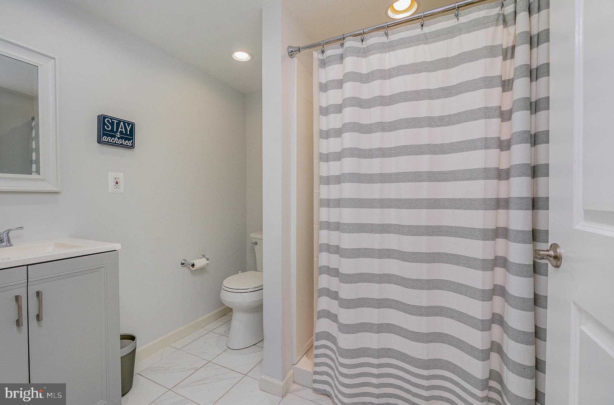 332 Miles Essex, MD 21221 - Photo 22 of 45 a bathroom with a toilet and a shower