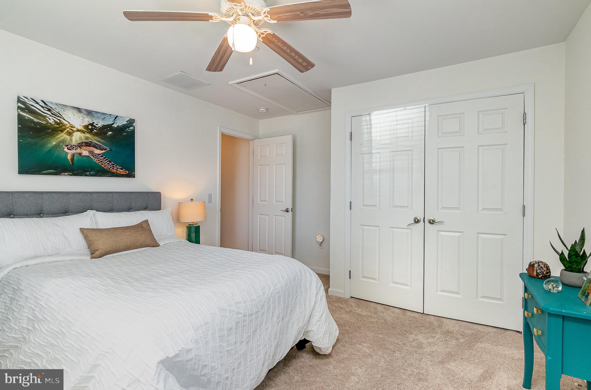 332 Miles Essex, MD 21221 - Photo 24 of 45 a bedroom with a bed and a chandelier