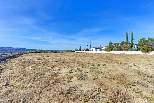 a view of a yard with an ocean