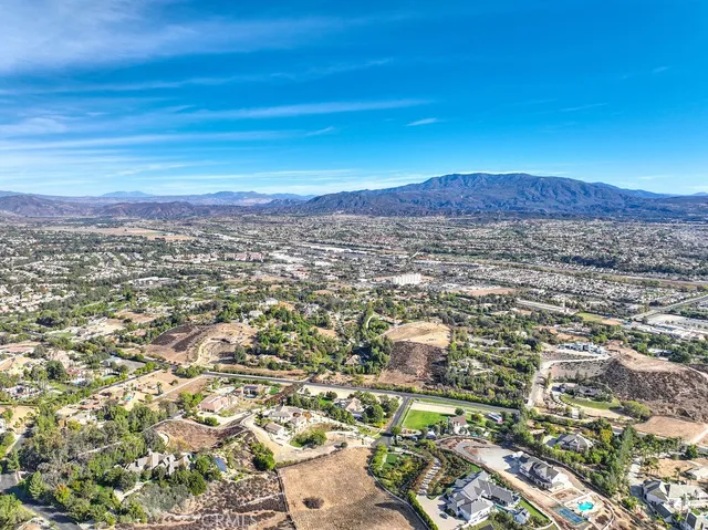 swimming pool view with a garden space