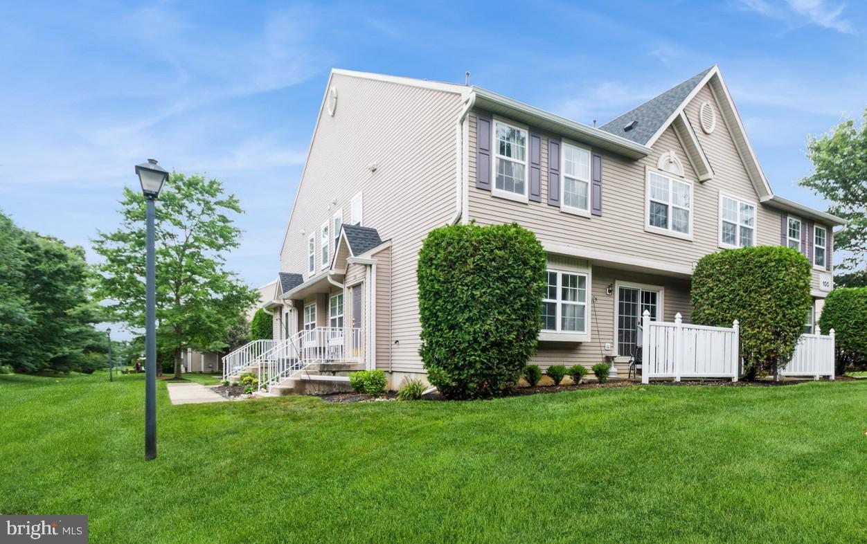 104 Coventry Way Mount Laurel, NJ 08054 - Photo 1 of 23 a front view of a house with a garden and plants