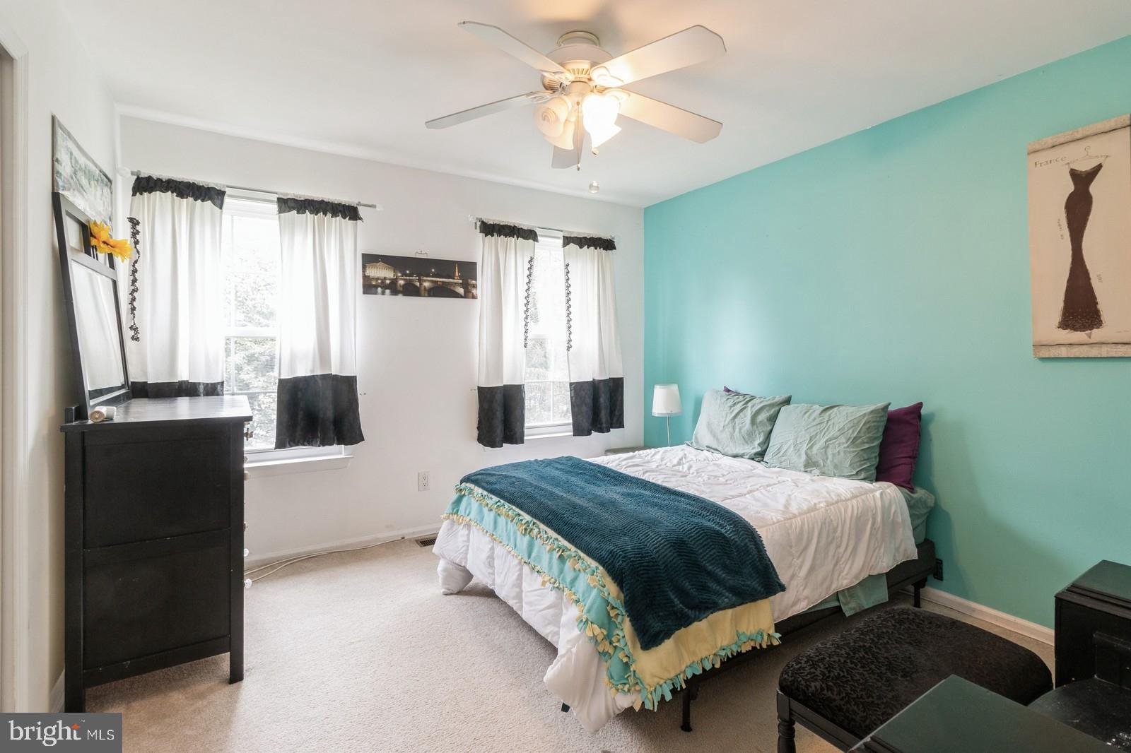 104 Coventry Way Mount Laurel, NJ 08054 - Photo 15 of 23 a bedroom with a bed and a refrigerator