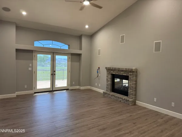a kitchen with granite countertop white cabinets and stainless steel appliances