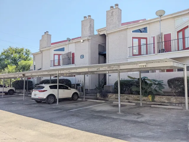 a car parked in front of a building