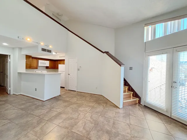 a view of an empty room with a window