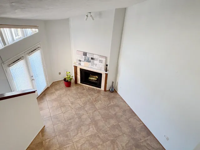 a view of empty room with a fireplace