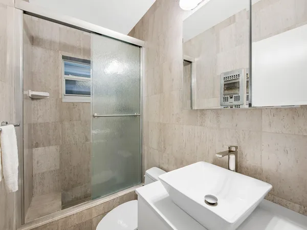 a bedroom with a bed and a desk