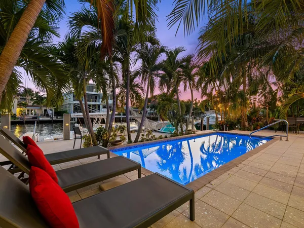 a view of a swimming pool with chairs