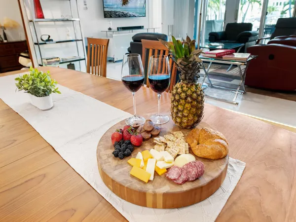 a bedroom with a bed and a lamp on dresser