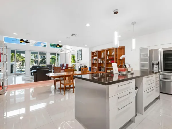 a view of a house with swimming pool and sitting area