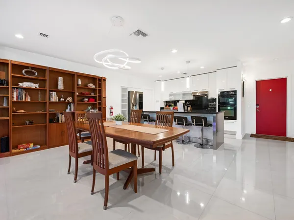 a view of a swimming pool with a table and chairs