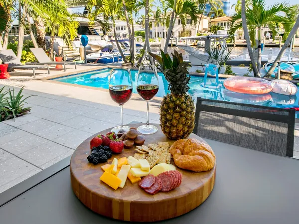 a view of a house with swimming pool and sitting area
