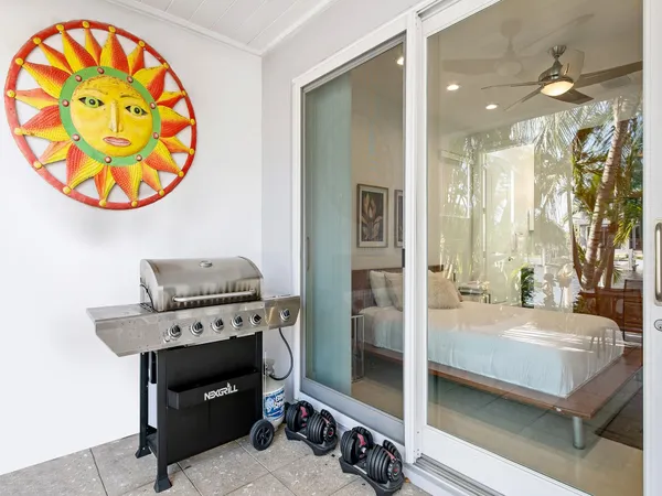 a view of a patio with swimming pool and furniture