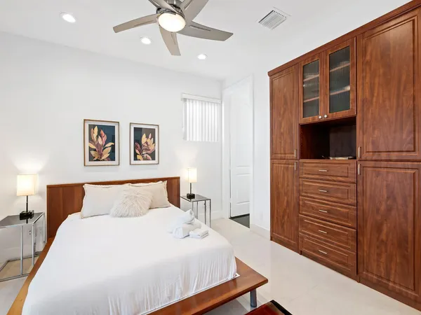 a kitchen with a sink a window and cabinets