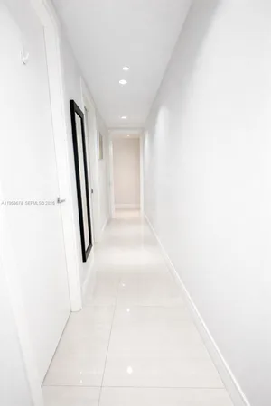 a balcony with wooden floor outdoor seating and city view