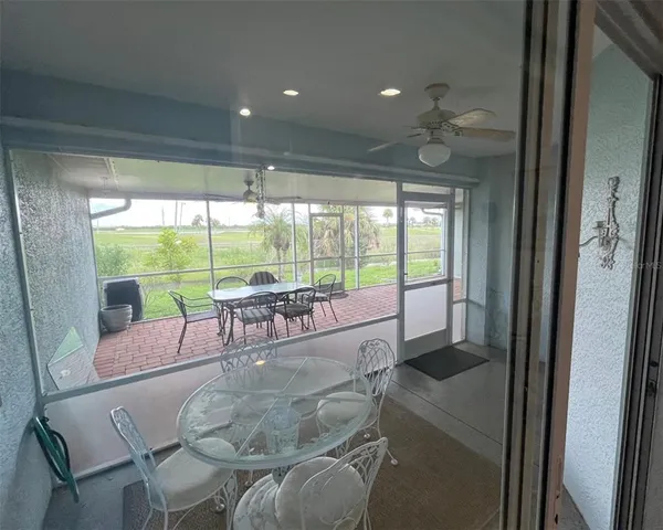 a view of a dining room with furniture window and outside view