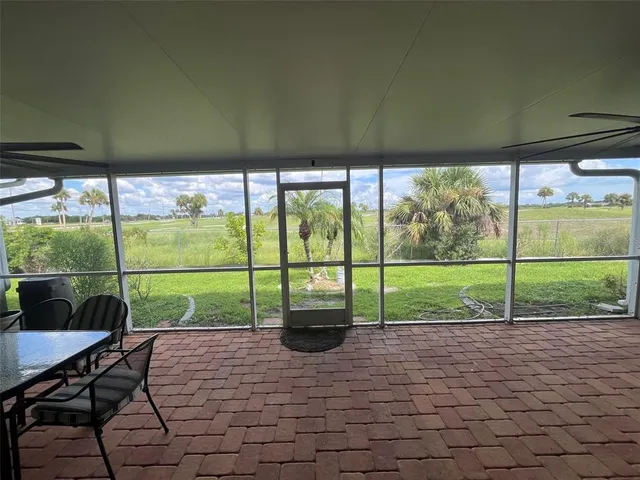 a bedroom with a large bed and flat tv