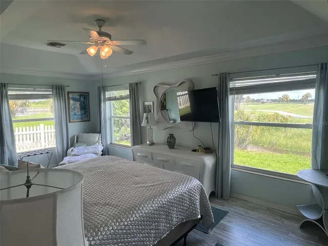 a bathroom with a tub a sink and glass door