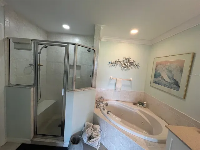 a bedroom with a bed couch and window