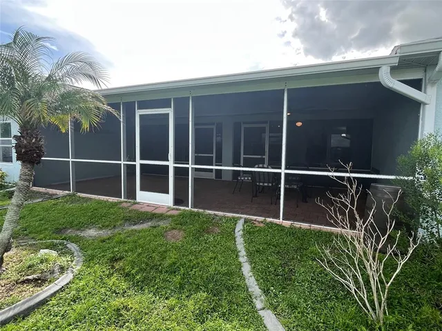 a view of a yard with car parked