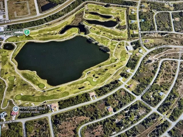 a blue sign that is on the side of a road