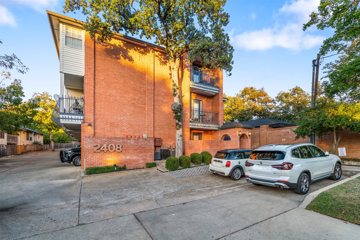 2408 Enfield Road, Unit 211 Austin, TX 78703 - Photo 2 of 26 View of apartment building / complex featuring uncovered parking