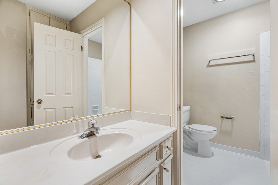 2408 Enfield Road, Unit 211 Austin, TX 78703 - Photo 21 of 26 Bathroom featuring vanity and light tile patterned floors
