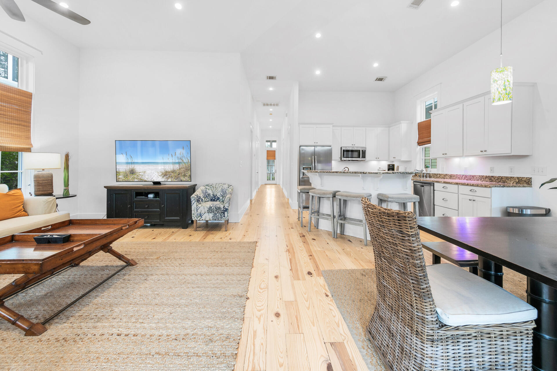 47 Cypress Walk Santa Rosa Beach, FL 32459 - Photo 5 of 46 a living room with stainless steel appliances furniture a rug kitchen view and a chandelier