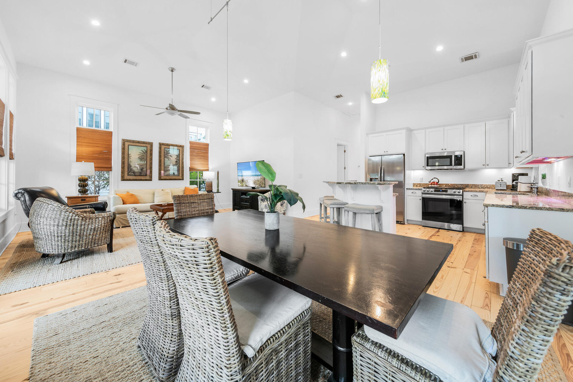 47 Cypress Walk Santa Rosa Beach, FL 32459 - Photo 7 of 46 a living room with stainless steel appliances furniture a fireplace a flat screen tv and a kitchen view
