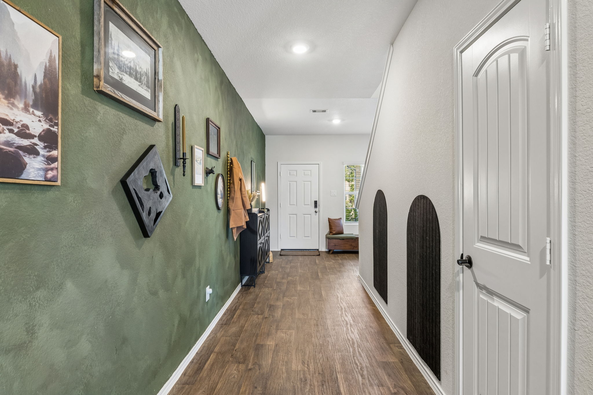 343 Sickle Loop Kyle, TX 78640 - Photo 9 of 40 Hallway featuring wood-finish flooring, recessed lighting, and a distinctive accent wall