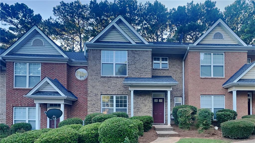 2019 Austin Park Circle Decatur, GA 30032 - Photo 1 of 1 a front view of a house with garden