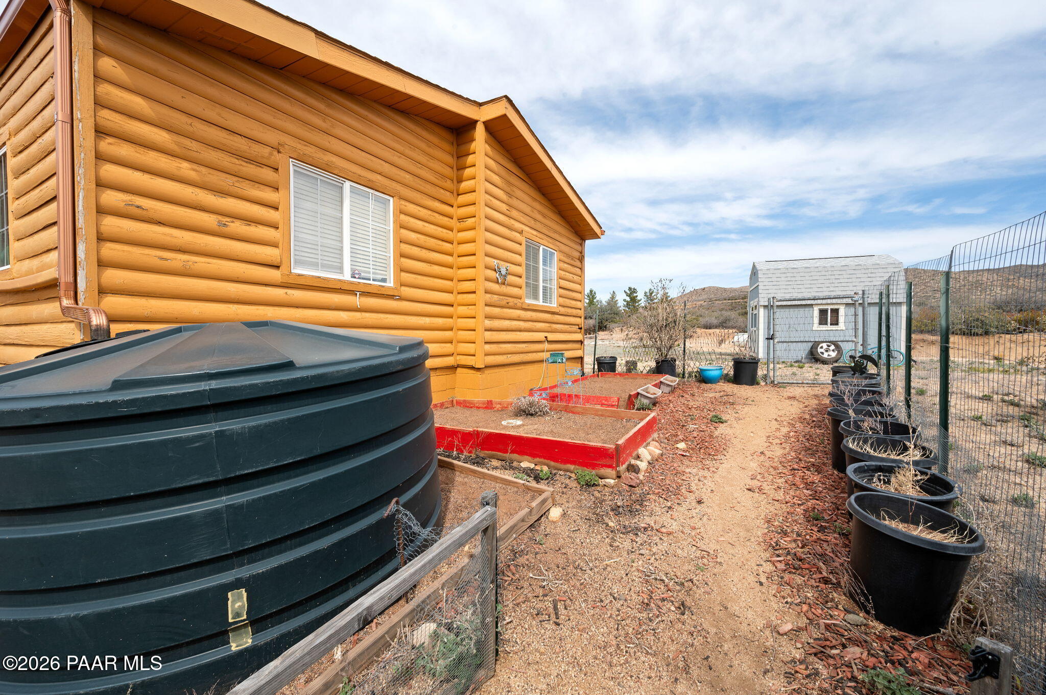 1675 Ark Landing, Unit 8 Dewey, AZ 86327 - Photo 29 of 35 Photo Side Yard Raised Beds