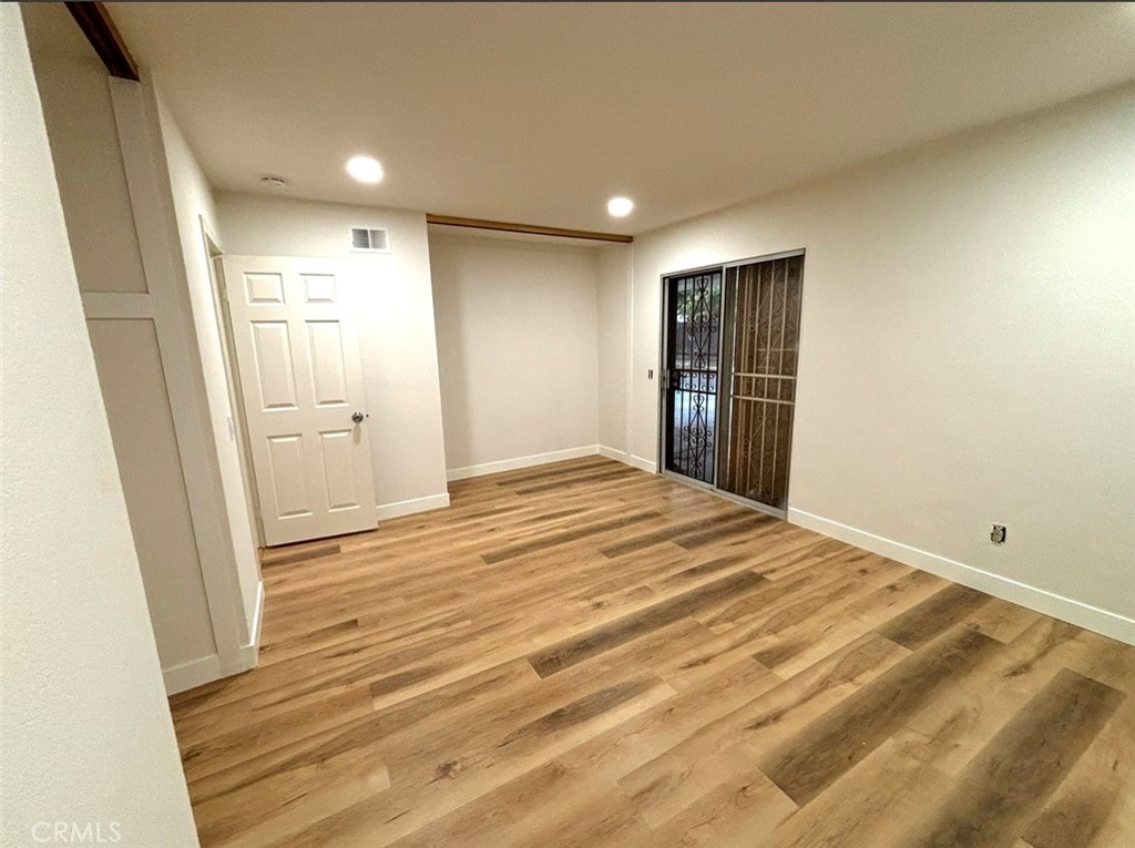 1164 Massachusetts Avenue Riverside, CA 92507 - Photo 13 of 14 a view of empty room with wooden floor