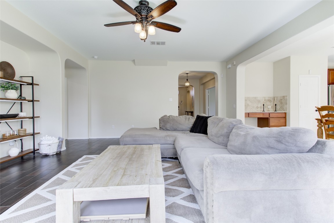 920 Autumn Sage Way Pflugerville, TX 78660 - Photo 14 of 30 a living room with furniture and a chandelier