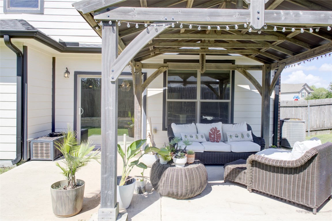 920 Autumn Sage Way Pflugerville, TX 78660 - Photo 2 of 30 a outdoor living space with furniture and garden view