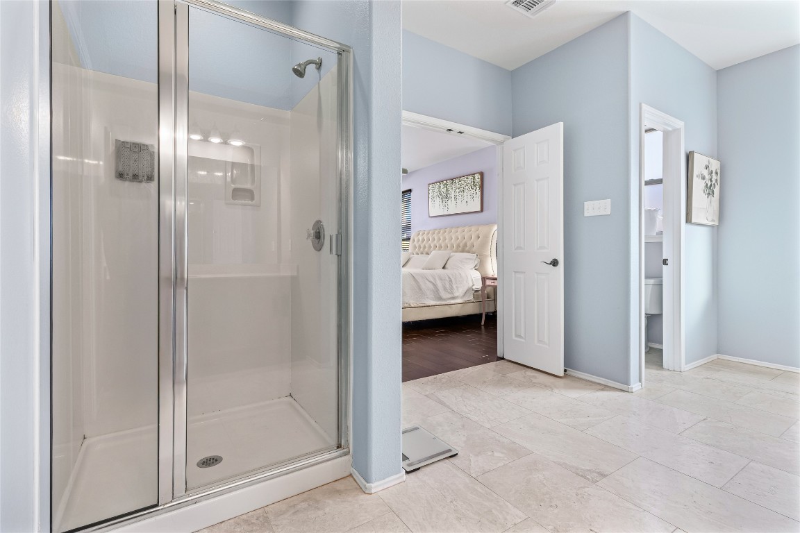 920 Autumn Sage Way Pflugerville, TX 78660 - Photo 22 of 30 a view of a bathroom with a glass door shower