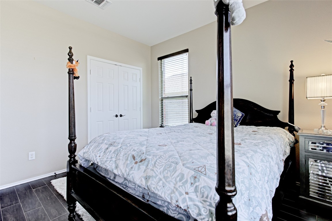 920 Autumn Sage Way Pflugerville, TX 78660 - Photo 23 of 30 a bedroom with a bed and a window