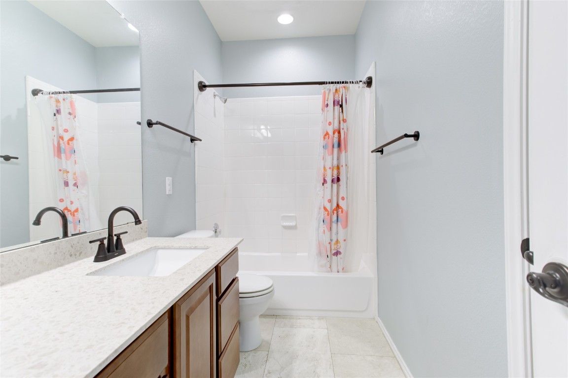 920 Autumn Sage Way Pflugerville, TX 78660 - Photo 25 of 30 a bathroom with a sink toilet and shower