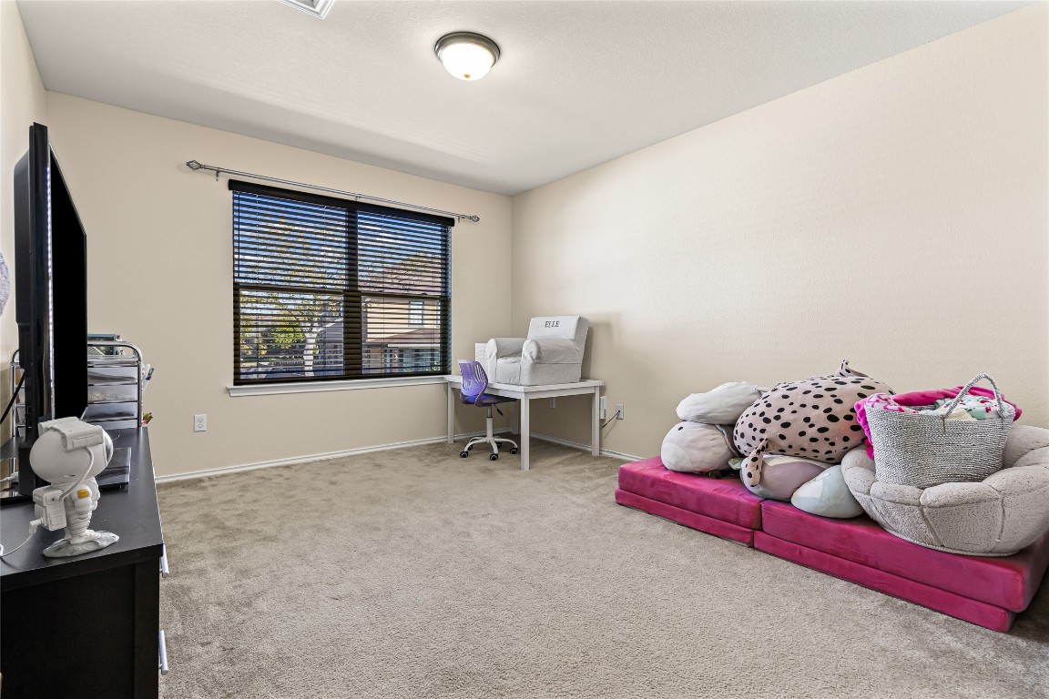 920 Autumn Sage Way Pflugerville, TX 78660 - Photo 27 of 30 a living room with furniture and a window