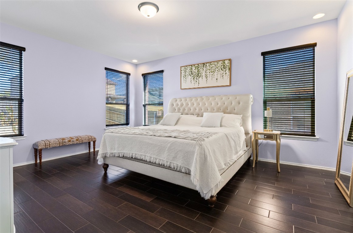 920 Autumn Sage Way Pflugerville, TX 78660 - Photo 3 of 30 a bed sitting in a bedroom next to a window