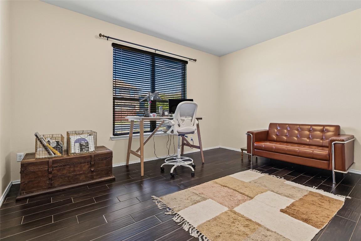 920 Autumn Sage Way Pflugerville, TX 78660 - Photo 9 of 30 a living room with furniture and wooden floor