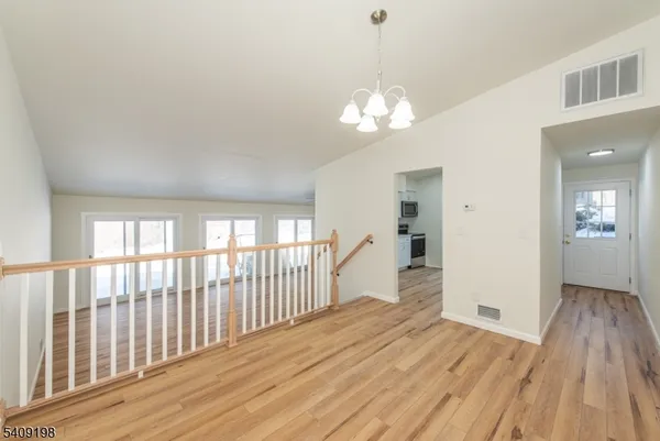 a view of a livingroom with wooden floor