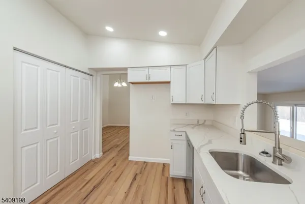 a kitchen with a sink and refrigerator