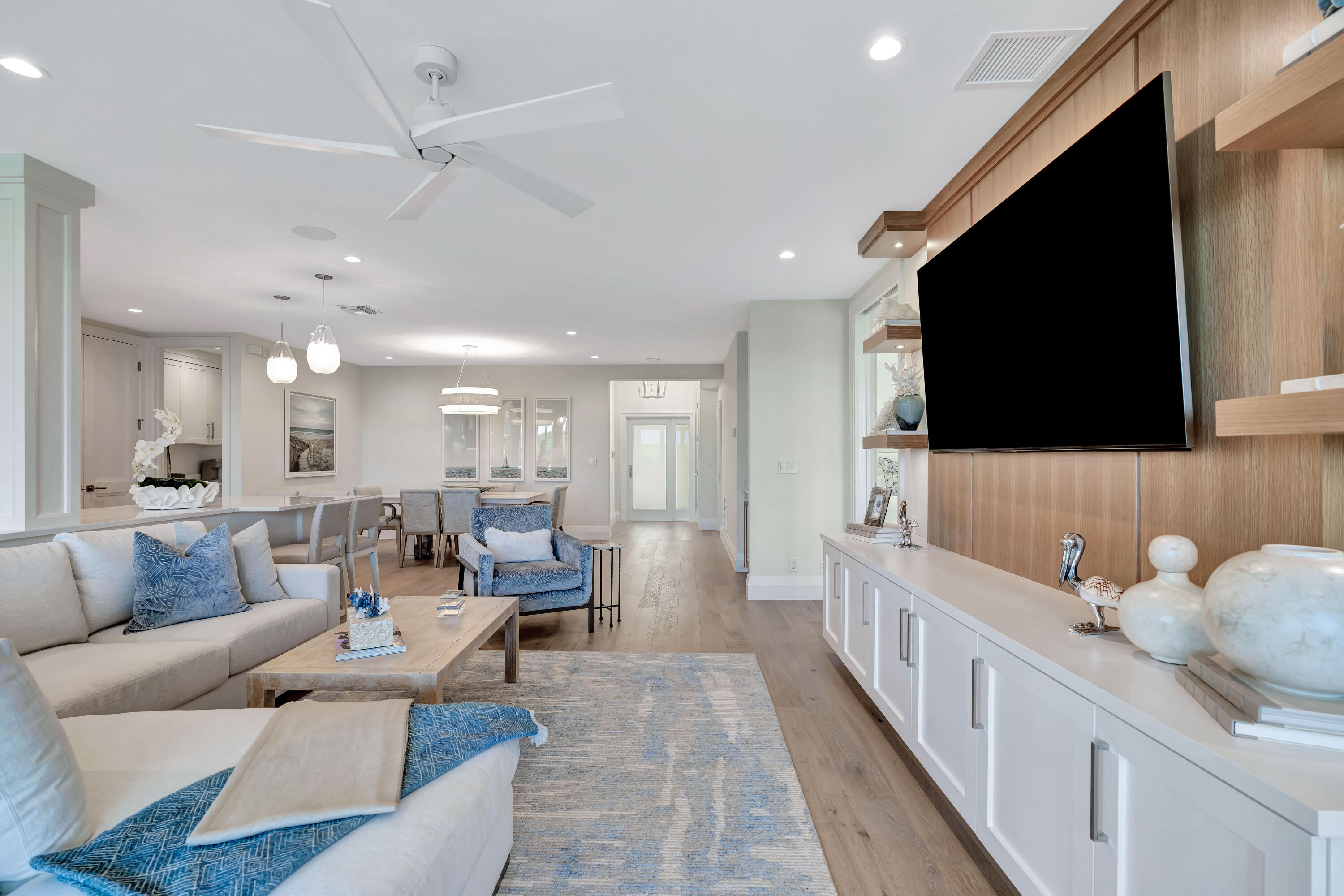 260 Eagle Drive Jupiter, FL 33477 - Photo 10 of 41 a living room with furniture and a flat screen tv