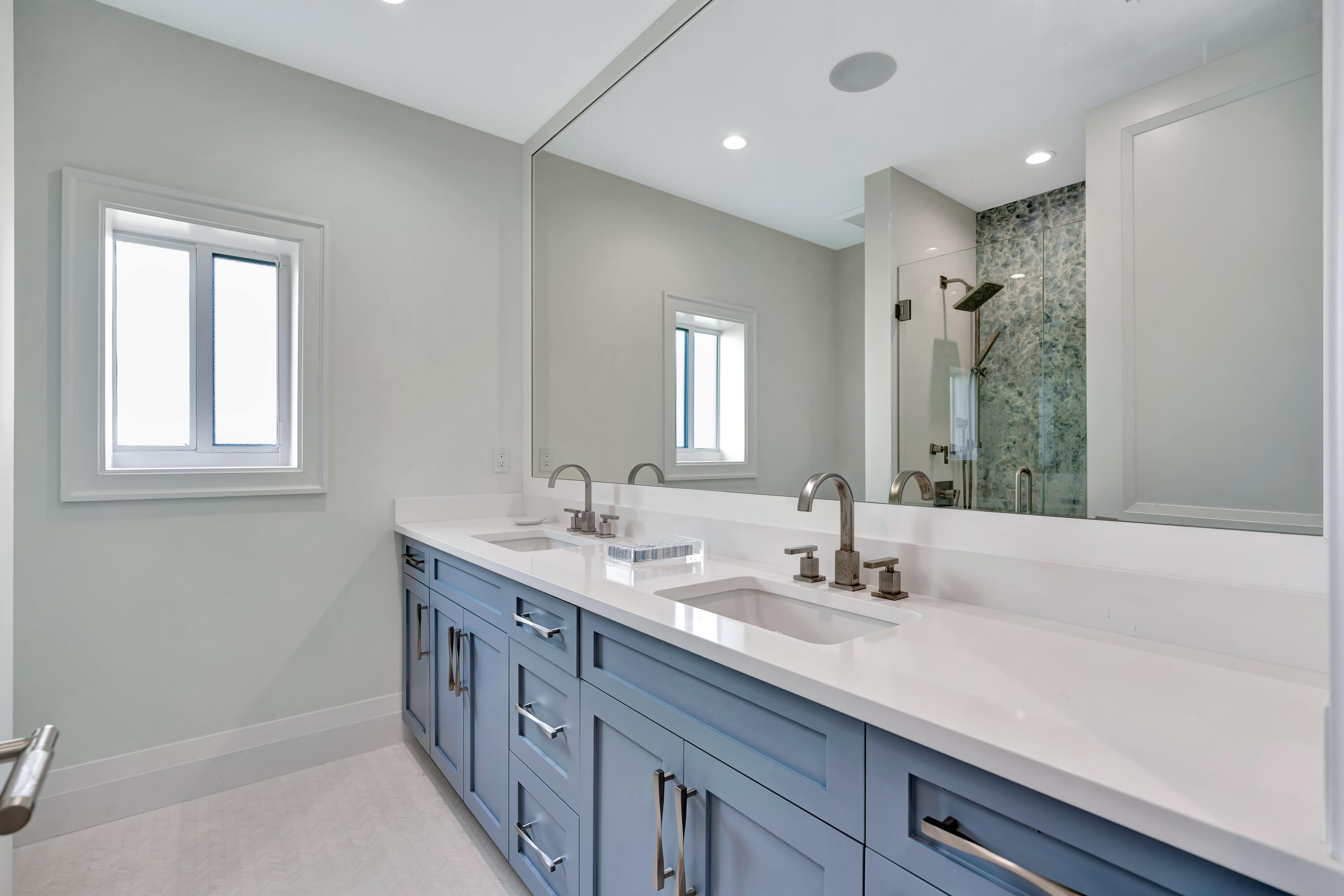 260 Eagle Drive Jupiter, FL 33477 - Photo 29 of 41 a bathroom with a double vanity sink and a mirror