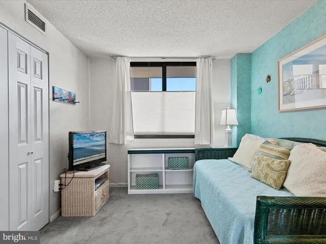 a living room with a couch and a flat screen tv