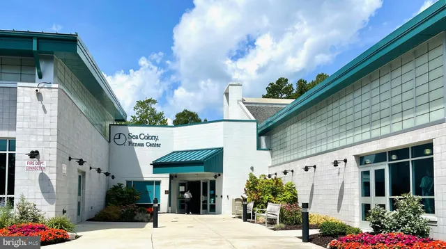 a view of swimming pool with furniture