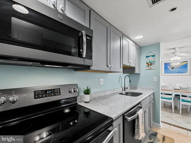 a kitchen with a stove microwave and cabinets