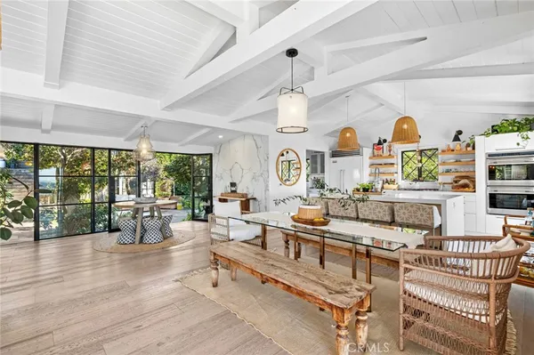 a living room with furniture a rug and a chandelier